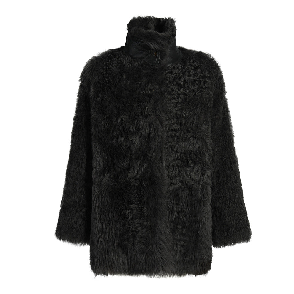 Premium black shearling coat from the Curve Collection, offering soft, dense shearling and a sophisticated design balancing luxury and comfort for plus-size wearers.