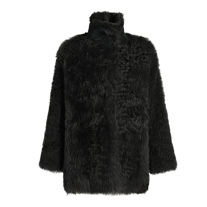 Premium black shearling coat from the Curve Collection, offering soft, dense shearling and a sophisticated design balancing luxury and comfort for plus-size wearers.