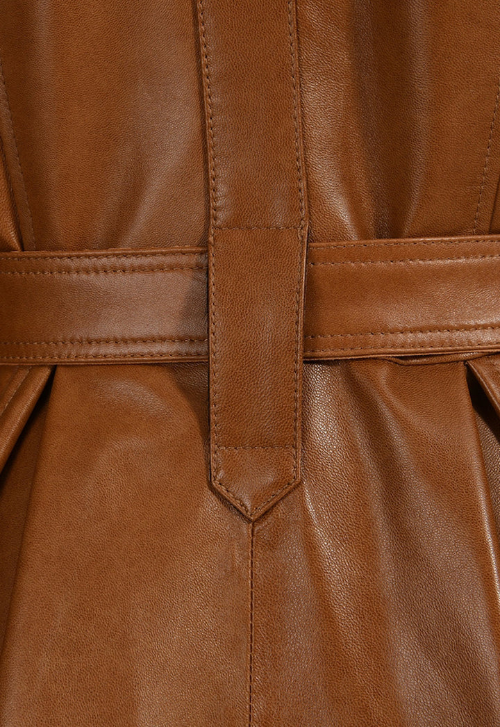 Close up of a long Brown leather trench coat with fur for women designer item. 
